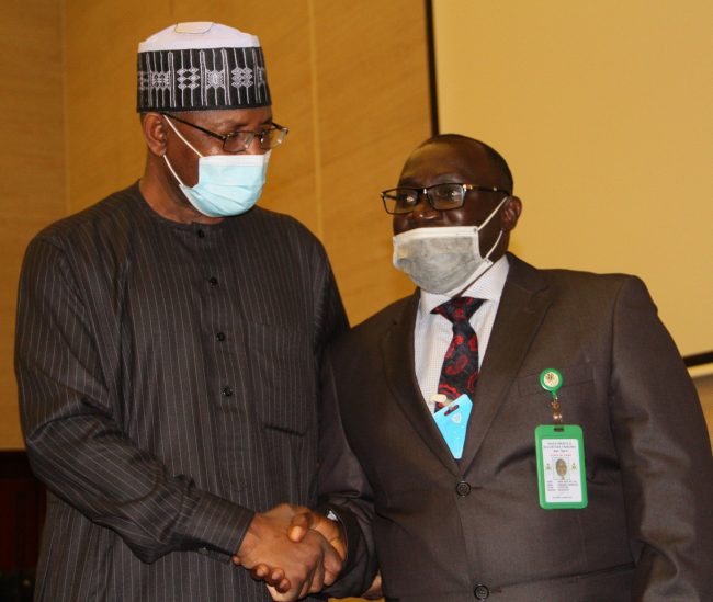 L-R, Director General, Securities and Exchange Commission Mr Lamido Yuguda with Chairman, Investments and Securities Tribunal Mr Amos Azi during the Inauguration of the IST Board Members by the Minister of Finance in Abuja